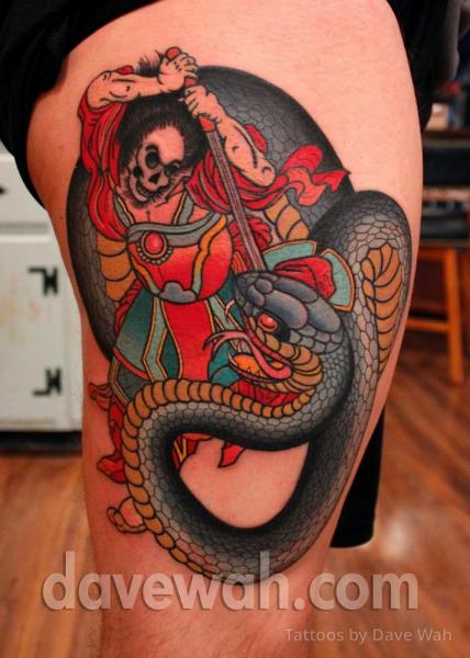 Snake and sword tattoo on the thigh